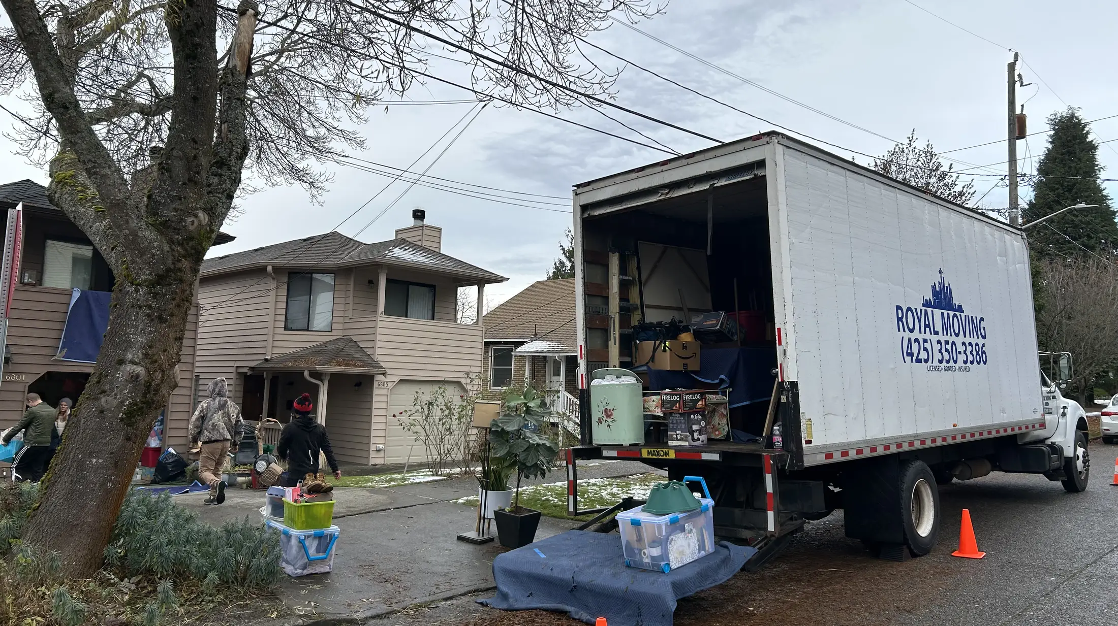 The crew loading the truck at a house