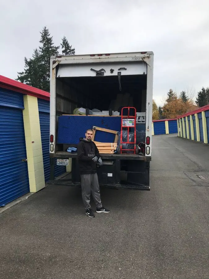 The truck backed up to a row of storage units