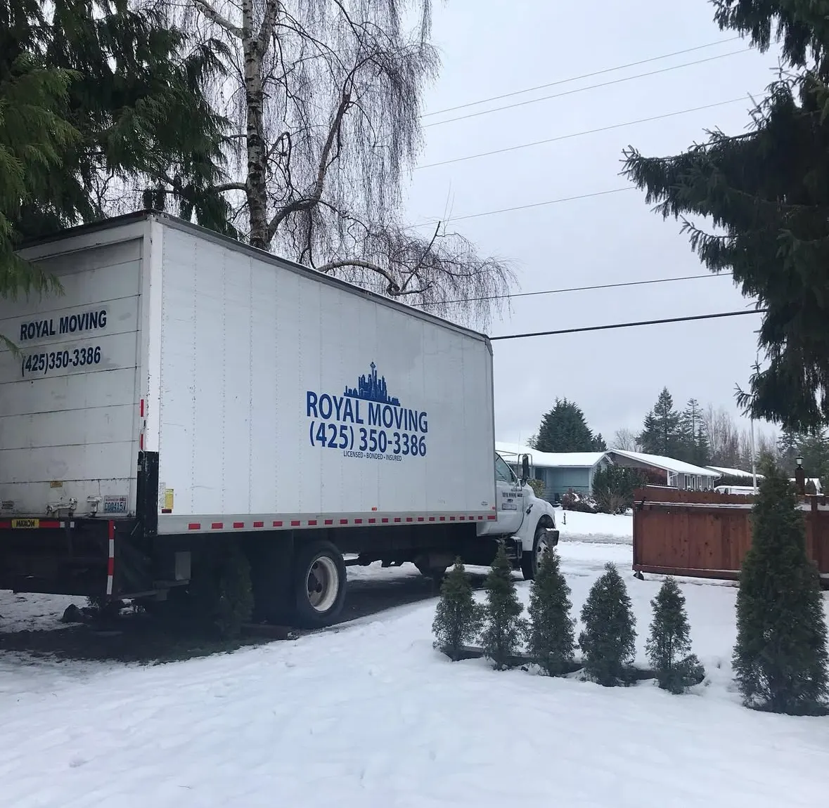 The Royal Moving truck parked on a snowy street