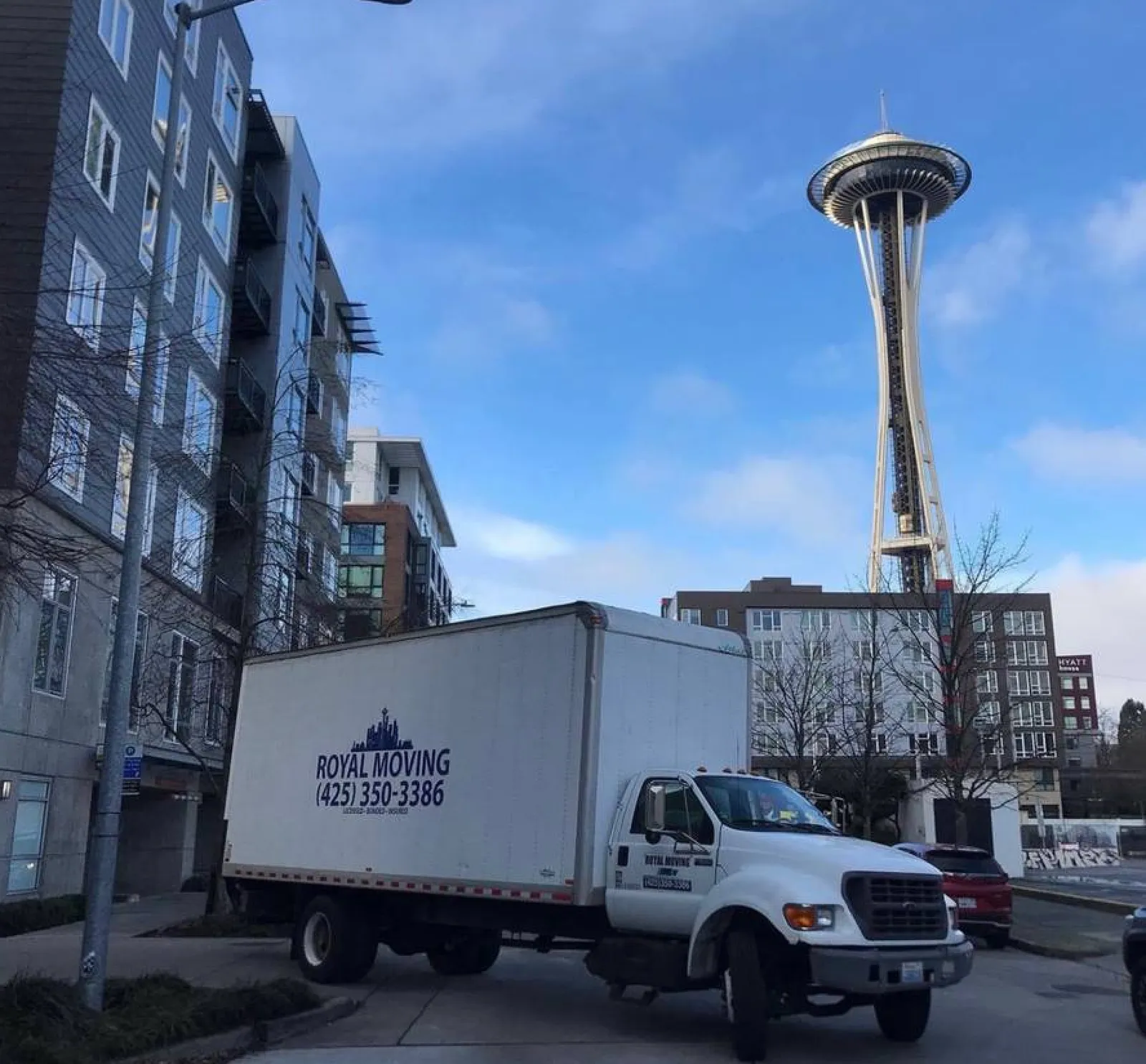 The Royal Moving truck below the Space Needle