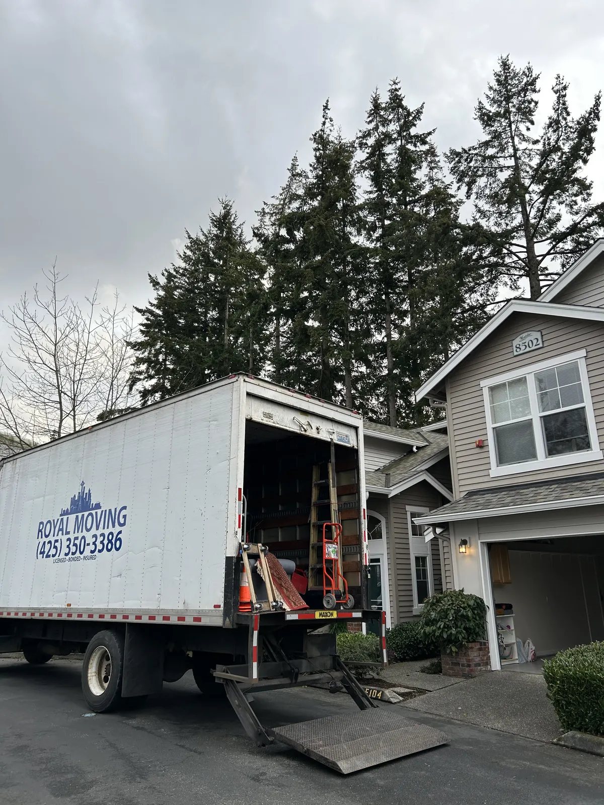 The truck backed into a driveway with the liftgate down